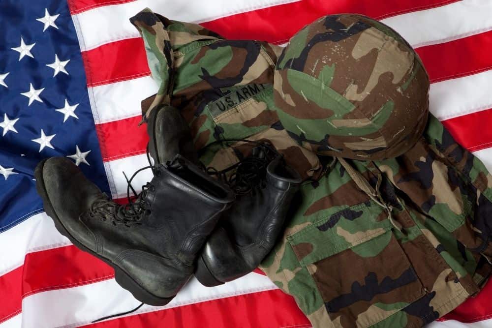 tactical boots and outfit on an American flag