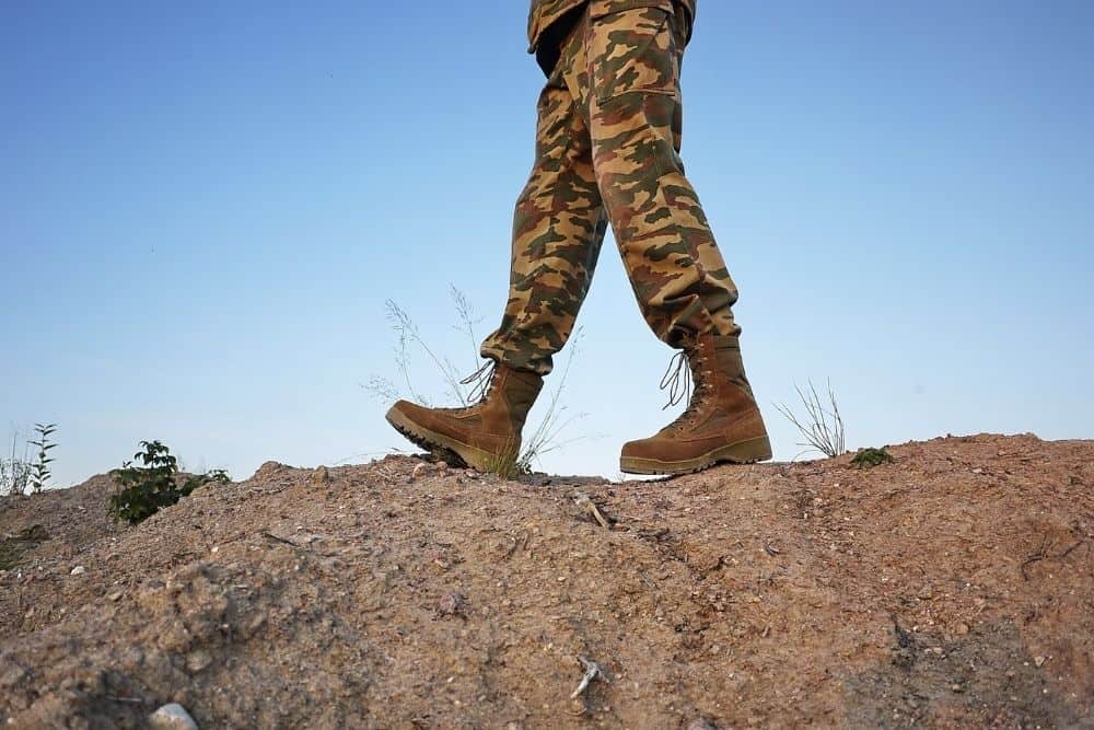 man wears tactical boots with ankle support