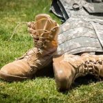 tactical boots and army armor on the grass