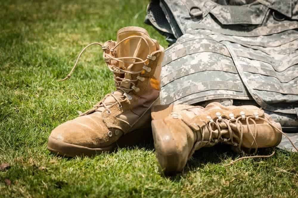 tactical boots and army armor on the grass