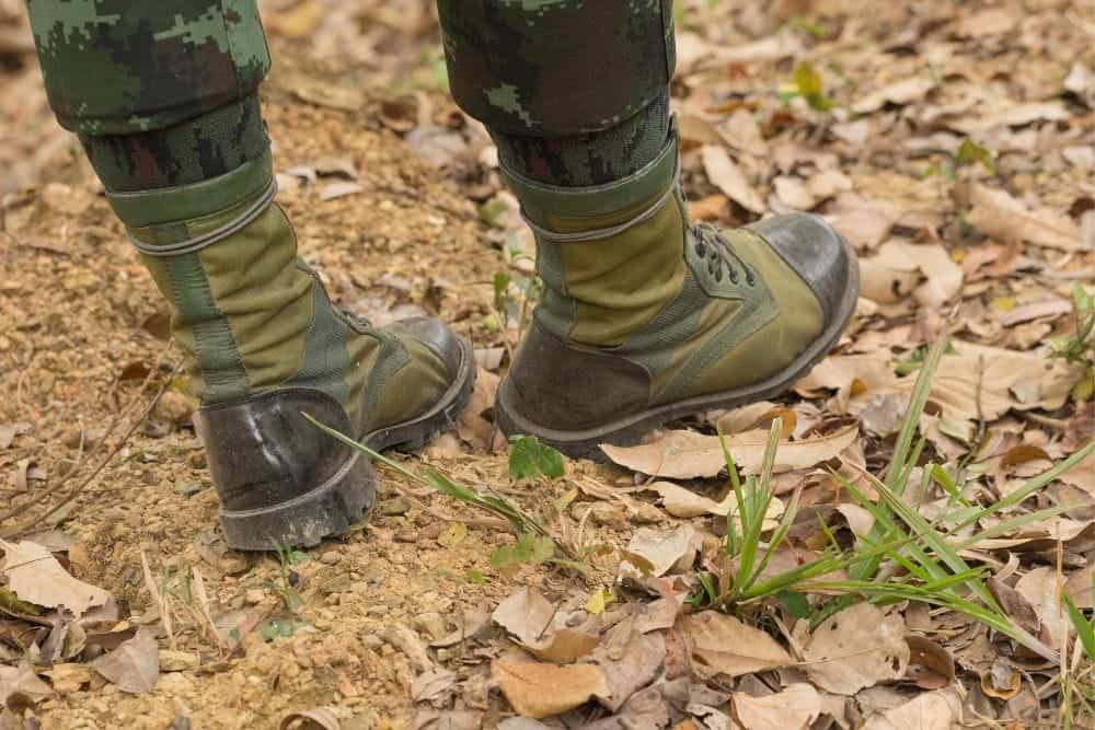 tactical boots on dry leaves