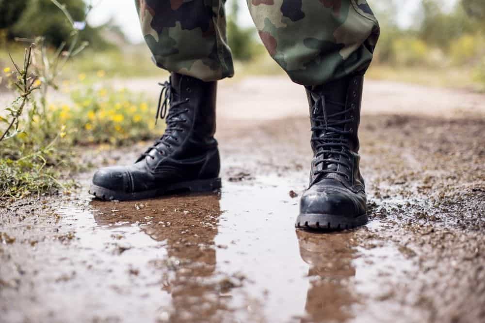 waterproof tactical boots on muddy terrain
