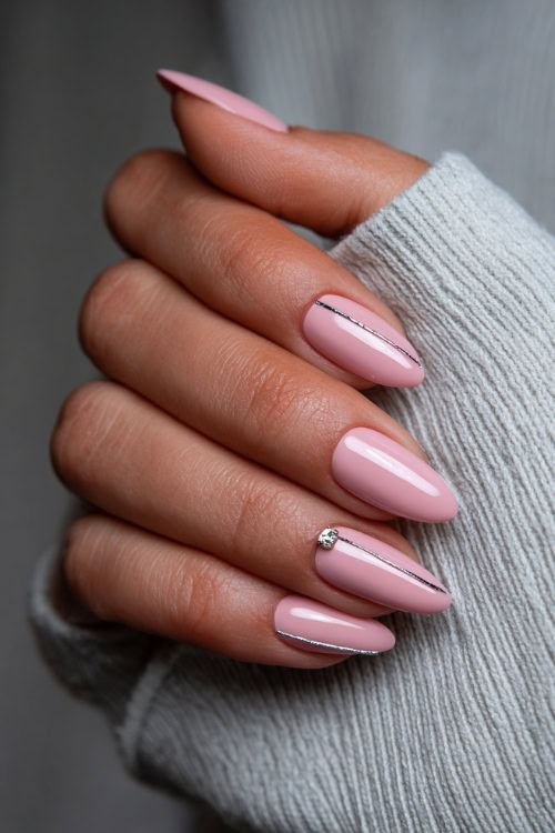 Hand adjusting bridal hairpin, almond nails in translucent pink with minimalist silver lines along the center of each nail