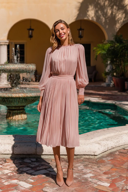 Elegant woman in a blush pink chiffon wedding guest dress with bishop sleeves and a pleated skirt, wearing ankle-strap heels, standing near a fountain in a spring courtyard wedding (2)