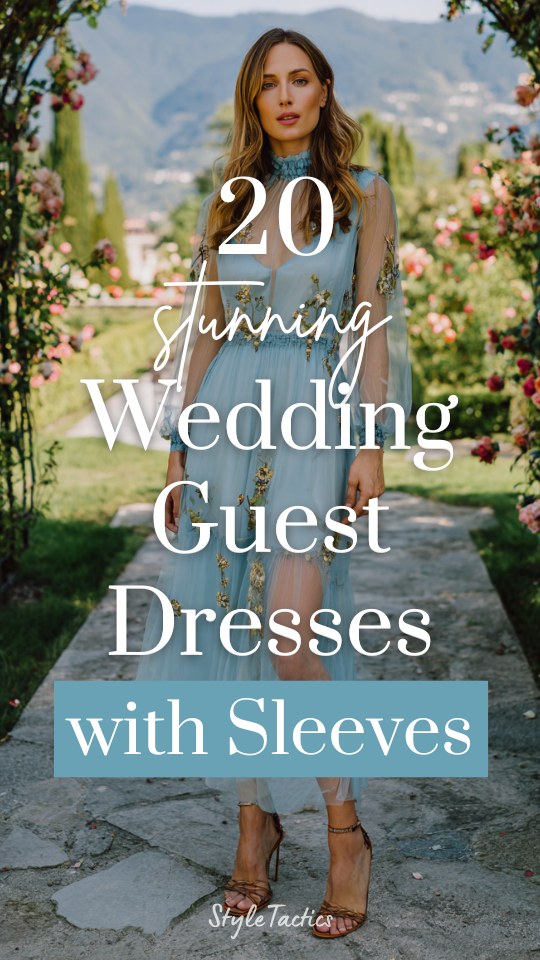 a woman wears a blue wedding guest dress with sleeves